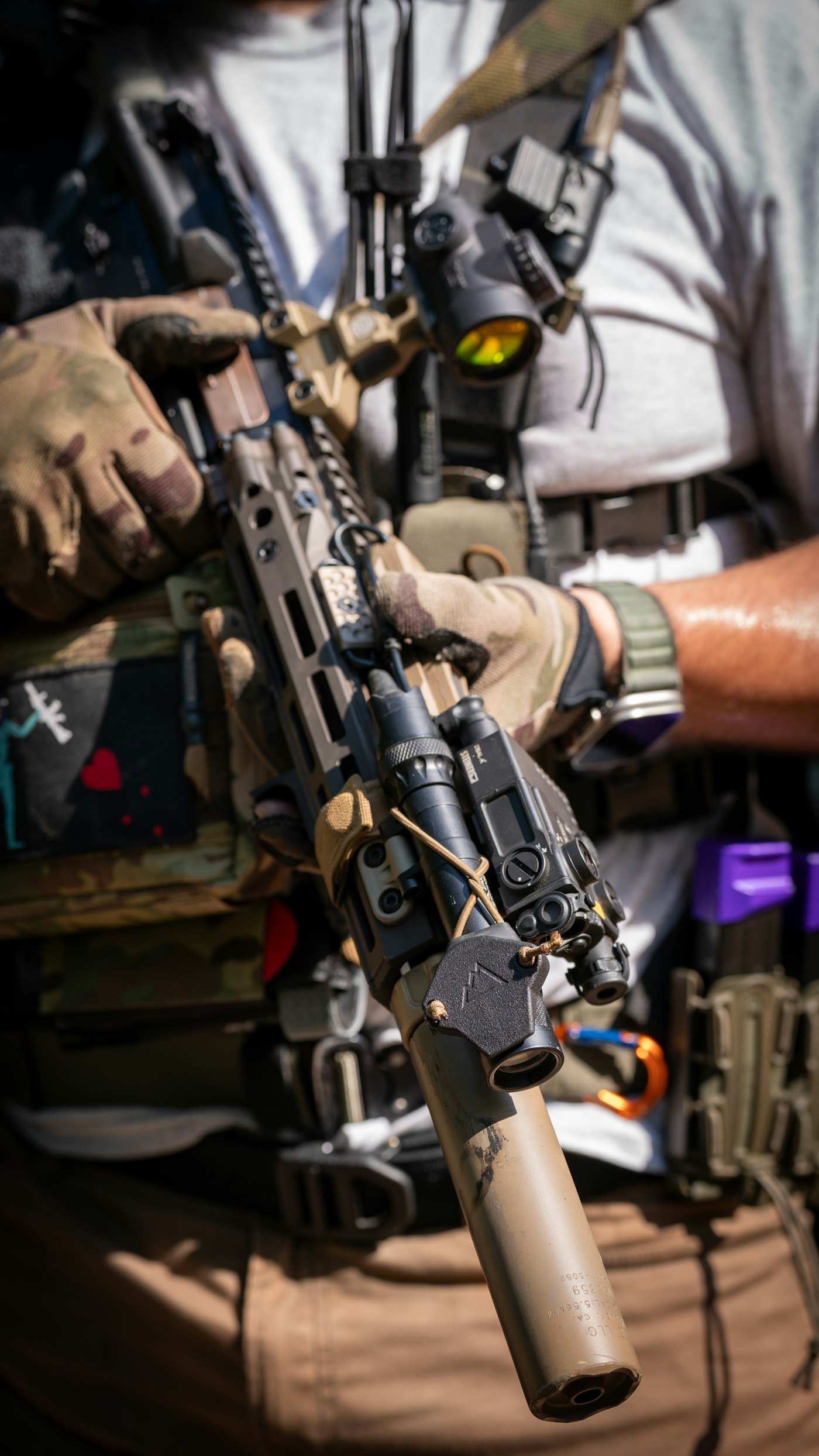 A man holding a machine gun in his hands