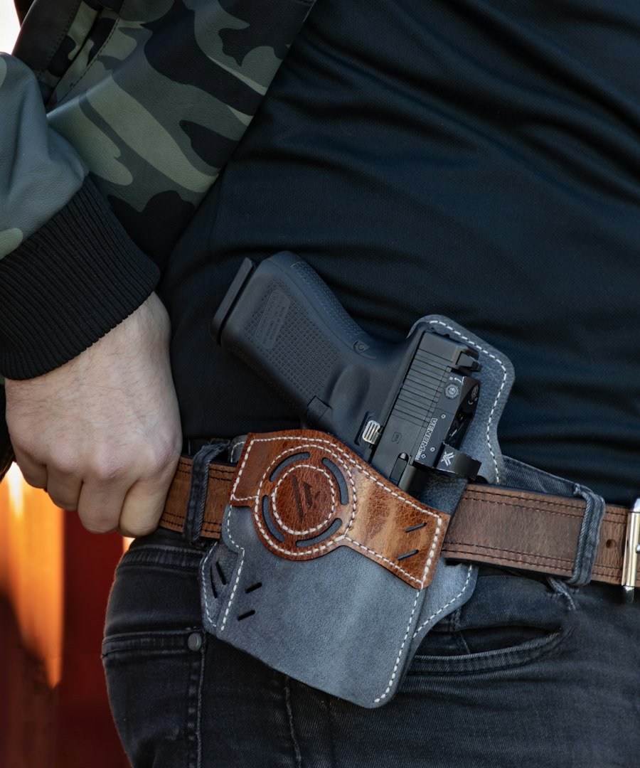 a man holding a gun in his pocket